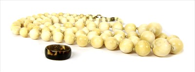 Lot 9 - A two row graduated ivory bead necklace