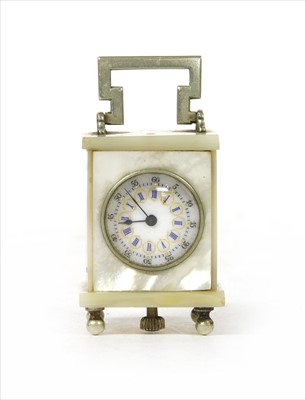 Lot 205 - A French mother-of-pearl miniature clock