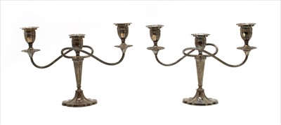 Lot 154 - A pair of modern silver three sconce candelabra