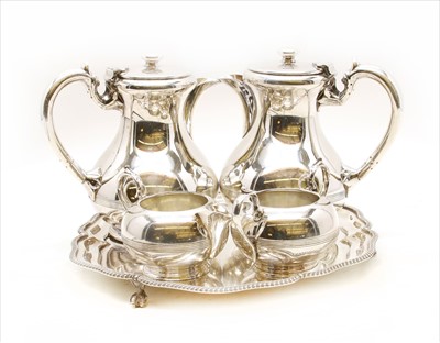 Lot 454 - A four piece Walker & Hall silver plated tea set on tray