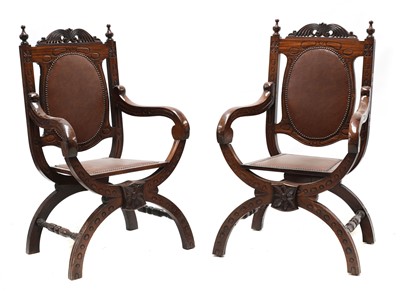 Lot 520 - A pair of mahogany 'X' frame open arm chairs