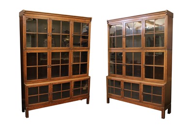 Lot 458 - A pair of glazed oak bookcases