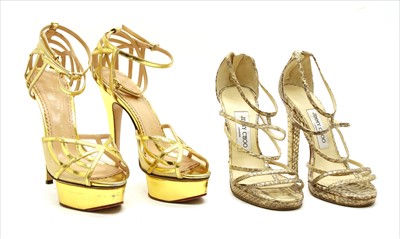 Lot 1048 - A pair of Jimmy Choo snakeskin strap sandals and a pair of Charlotte Olympia gold tone strap sandals