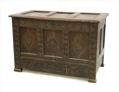 Lot 662 - An 18th Century and later carved oak coffer