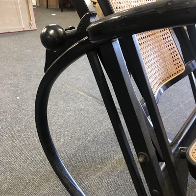 Lot 186 - An ebonised wooden rocking chair