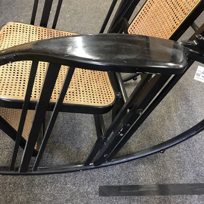 Lot 186 - An ebonised wooden rocking chair
