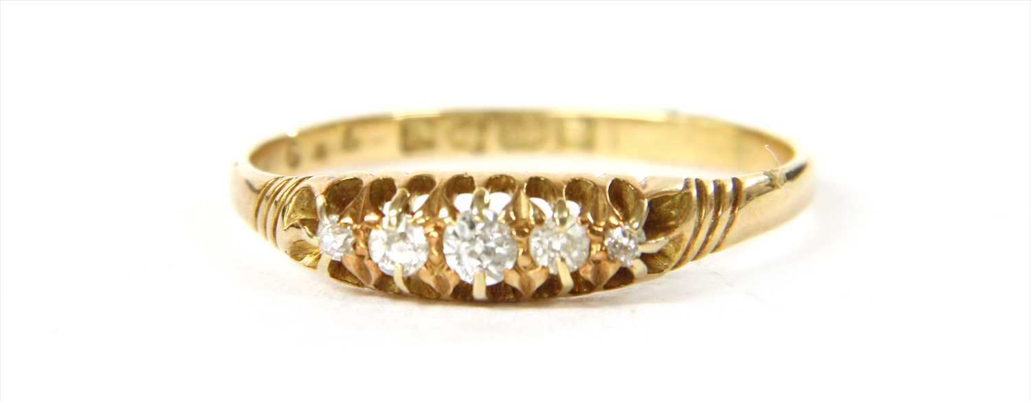 Lot 19 - An 18ct gold boat shaped five stone diamond ring