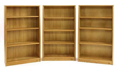 Lot 272 - A set of three oak open bookcases
