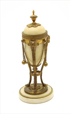 Lot 131 - A French white marble and gilt bronze cassolette candlestick
