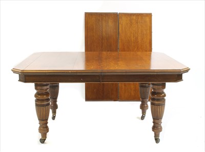 Lot 454 - A Victorian oak extending dining table