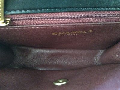 Lot 411 - A Chanel black lambskin petit flap bag