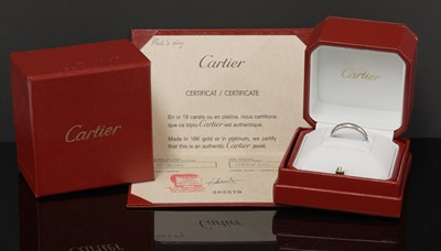 Lot 308 - A platinum 'D' shaped wedding ring by Cartier