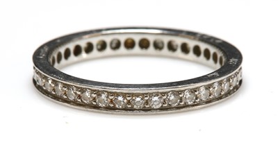 Lot 280 - A platinum diamond set full eternity ring by Cartier