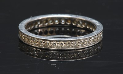Lot 280 - A platinum diamond set full eternity ring by Cartier