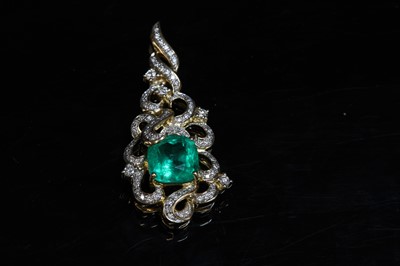 Lot 206 - An 18ct gold emerald and diamond pendant