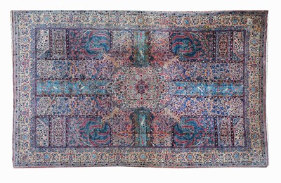 Lot 584 - A large Persian Kirman carpet