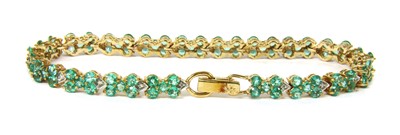 Lot 44 - A 9ct gold emerald and diamond bracelet