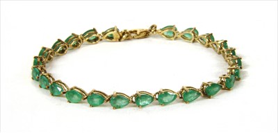 Lot 34 - A silver gilt emerald line bracelet