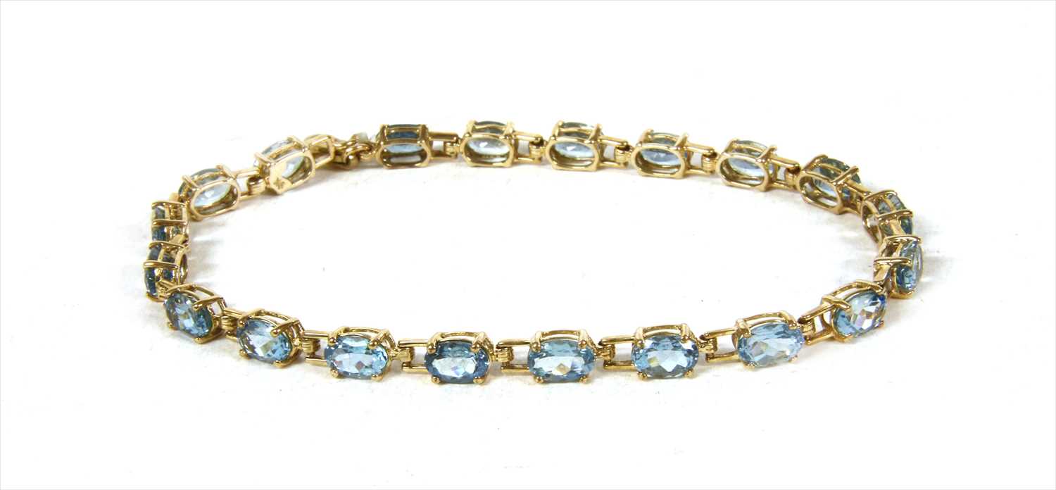 Lot 33 - A gold aquamarine line bracelet