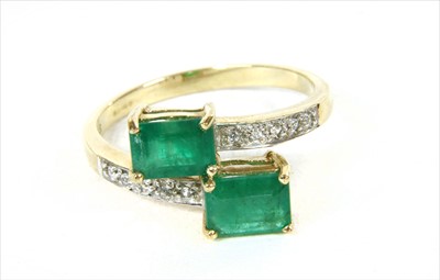 Lot 63 - A 9ct gold emerald crossover ring