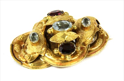 Lot 26 - A Victorian gold, aquamarine and garnet knot brooch