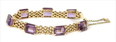 Lot 32 - A gold amethyst three row panther link bracelet