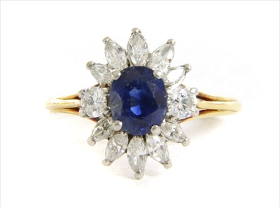 Lot 234 - A gold sapphire and diamond cluster ring