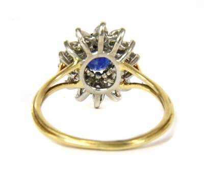 Lot 234 - A gold sapphire and diamond cluster ring