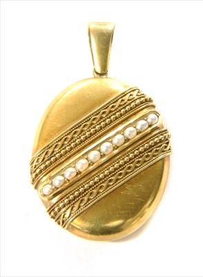 Lot 82 - A Victorian gold split pearl oval locket