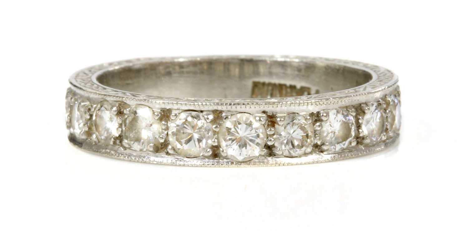 Lot 194 - A platinum diamond set half eternity ring