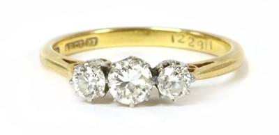 Lot 157 - A gold and platinum three stone diamond ring