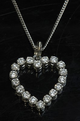 Lot 302 - A white gold diamond set heart-shaped pendant and chain