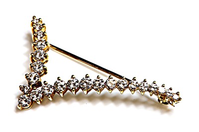 Lot 83 - A gold diamond set 'V' or stylised bird in flight brooch
