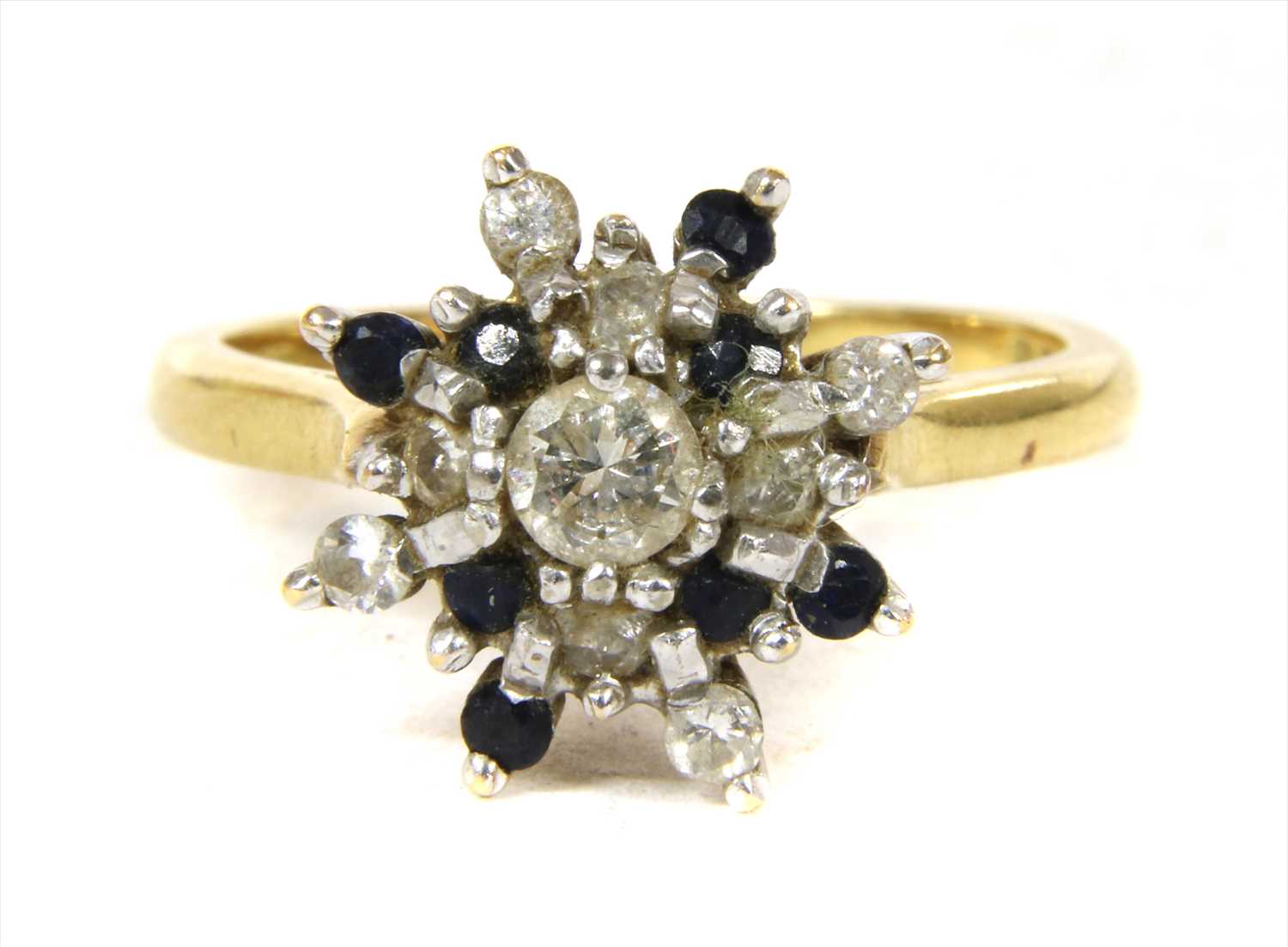 Lot 51 - An 18ct gold diamond and sapphire cluster ring