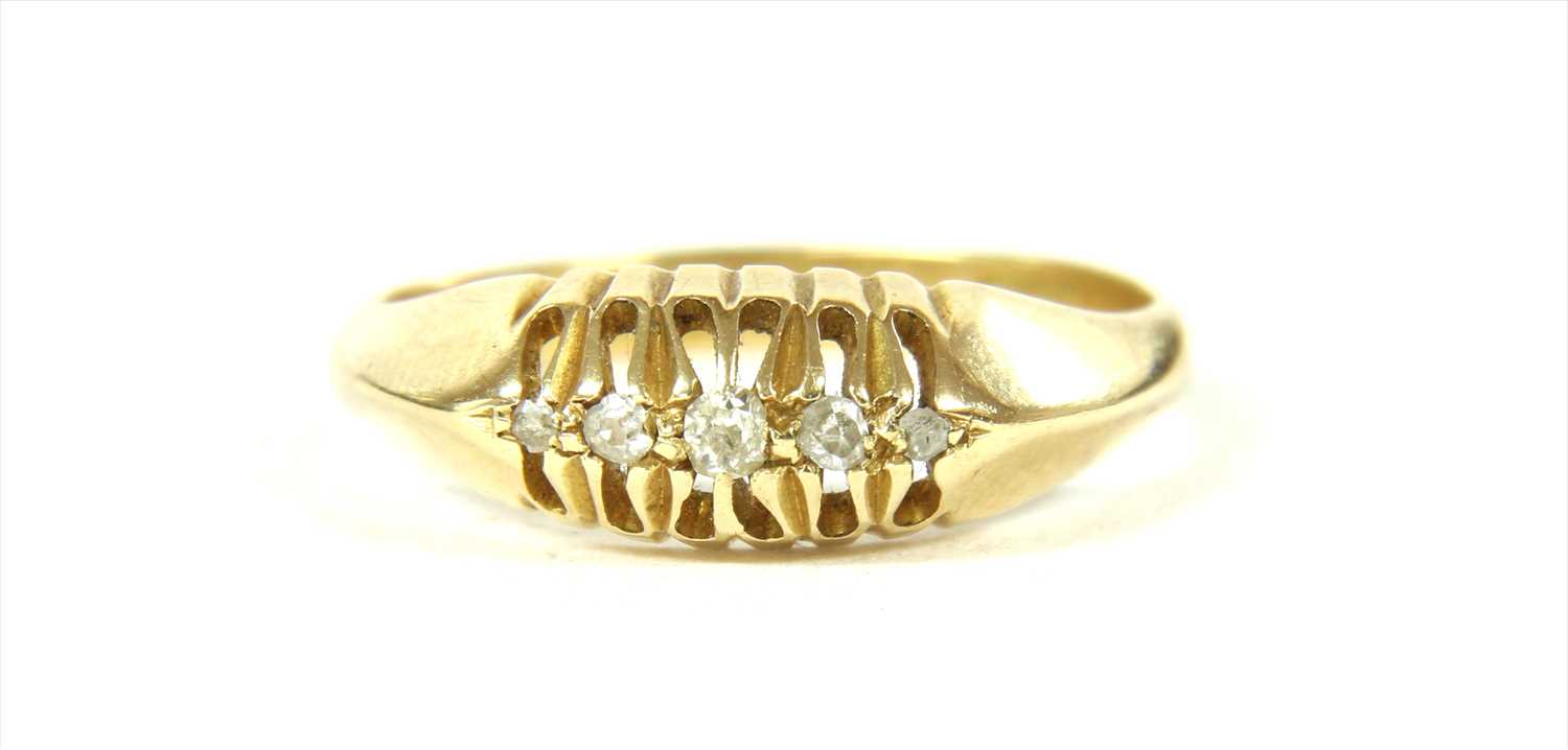 Lot 17 - An 18ct gold boat shaped five stone diamond ring
