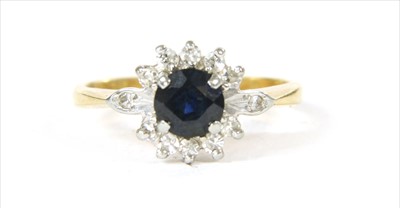 Lot 52 - An 18ct gold sapphire and diamond cluster ring
