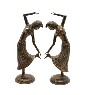 Lot 175 - A pair of white metal Eastern female dancers (2)