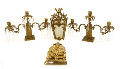 Lot 285 - A pair of gilt metal candelabra
