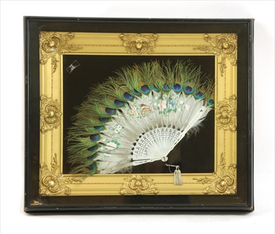 Lot 395 - A peacock feather and bone fan