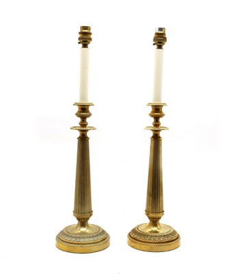 Lot 189 - A pair of Empire style brass column table lamps, (2)