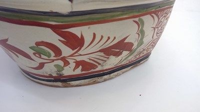 Lot 222 - A Chinese pottery pillow