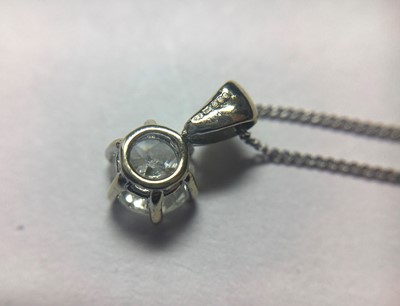 Lot 54 - An 18ct white gold single stone diamond pendant