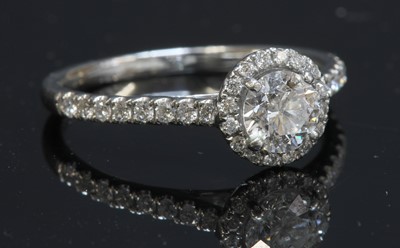 Lot 306 - A platinum diamond halo cluster ring