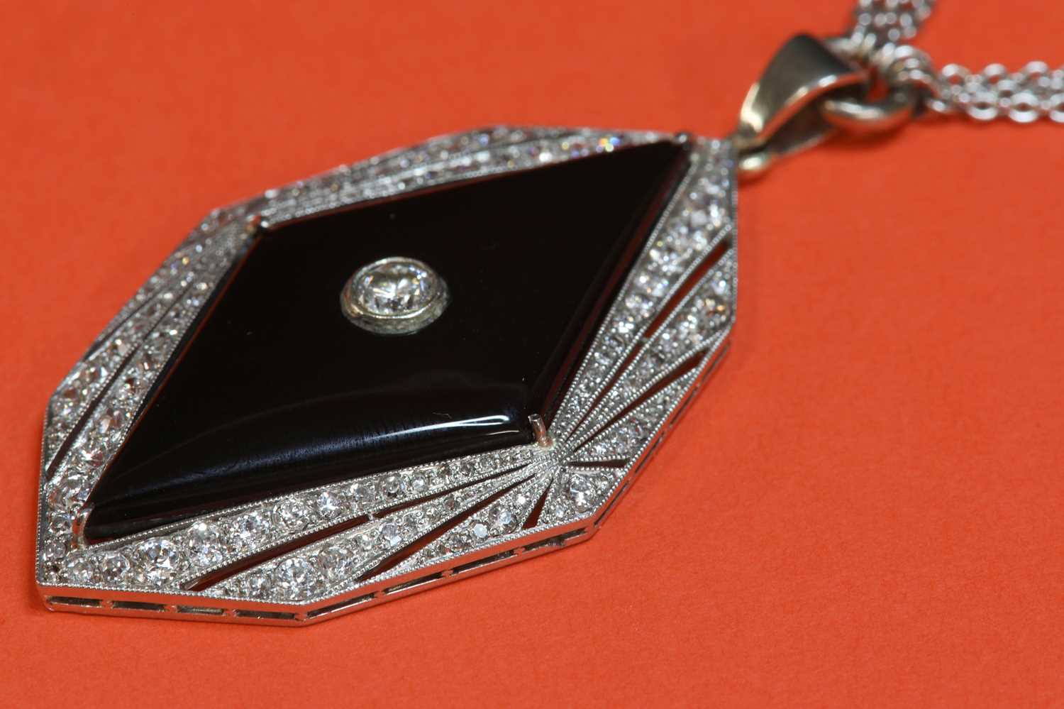 An American Art Deco diamond and onyx plaque pendant,