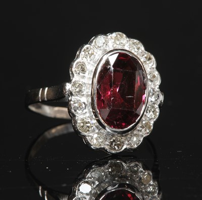 Lot 192 - A spinel and diamond oval cluster ring