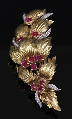 Lot 145 - An 18ct yellow and white gold ruby and diamond spray brooch, c.1960
