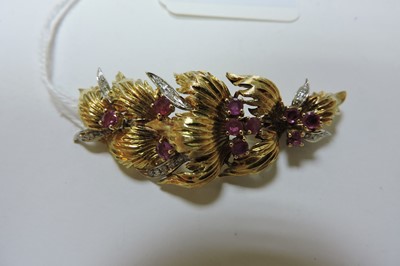 Lot 145 - An 18ct yellow and white gold ruby and diamond spray brooch, c.1960