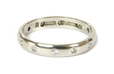 Lot 53 - A platinum diamond wedding ring