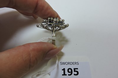Lot 195 - A white gold diamond and sapphire marquise-shaped cluster ring