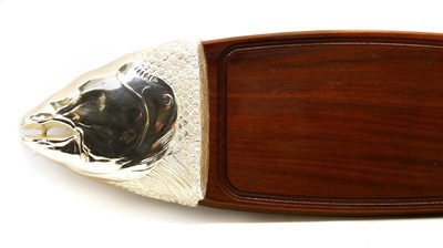 Lot 93 - A hardwood and polished metal salmon carving board